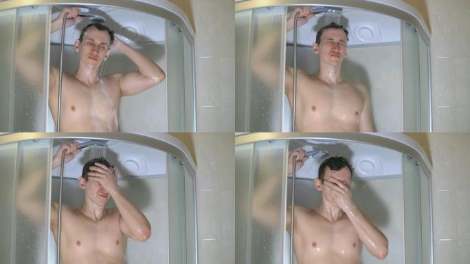一个英俊的男人在洗澡的时候洗他的头