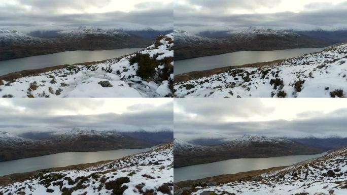 苏格兰山脉和积雪覆盖的湖