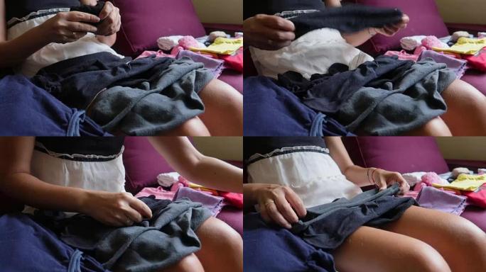 高清: 年轻女子折叠洗衣-库存视频