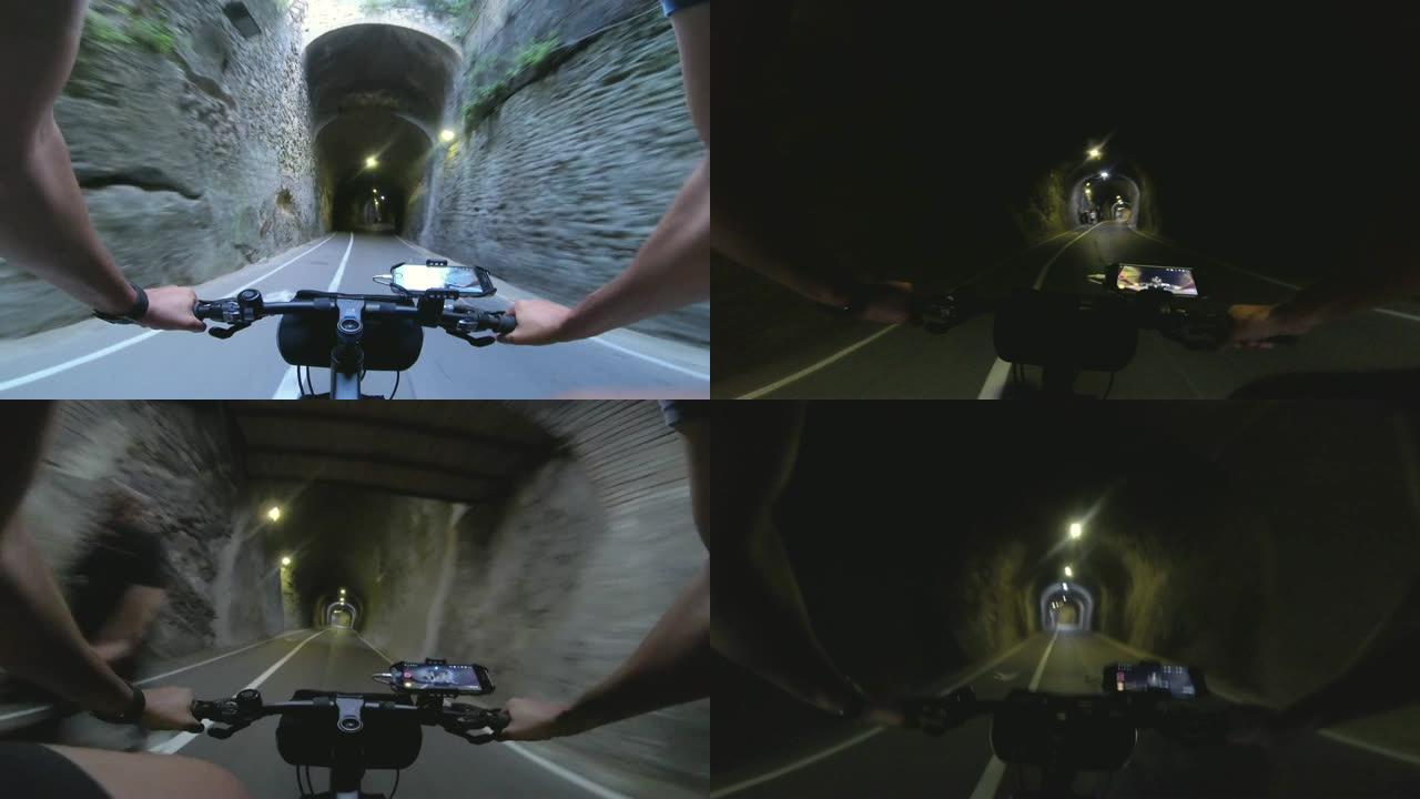 在意大利庞扎岛的一个隧道下，一名骑自行车的男子在公路上骑车
