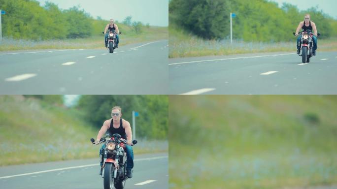 骑摩托车的人朝摄像机驶去。摄像机在骑自行车的人的后面有一个跟踪焦点。浅景深