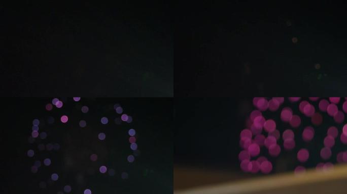 日本北海道小樽庆祝日夜空中五颜六色的烟花拍摄的模糊视频