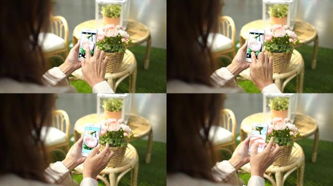 亚洲妇女使用智能手机拍照