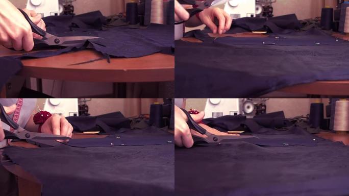 裁缝剪掉布料。