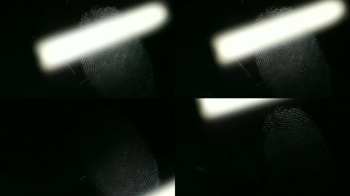关闭扫描仪的镜头，分析留在表面上的指纹