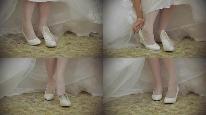 新娘穿上鞋子。美丽的新娘为婚礼做准备