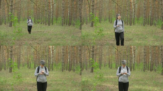 背着背包的女人穿过森林。前视图