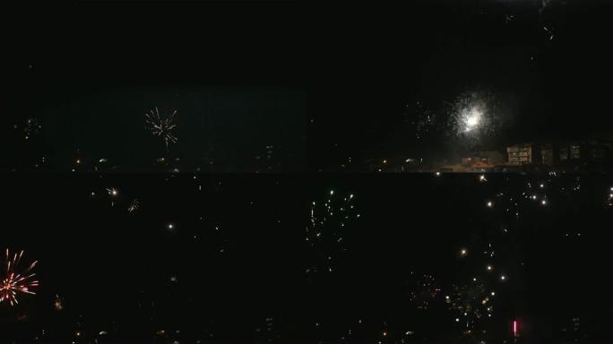 新年庆祝城市烟花天空照亮城镇黑夜爆竹