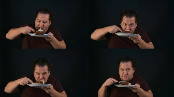 有趣的胖子吃蛋糕。