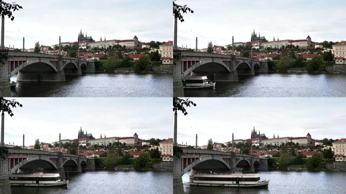 一艘游船在布拉格的manes桥下经过