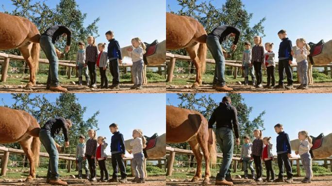 牧场老板向孩子们展示如何清洁马蹄