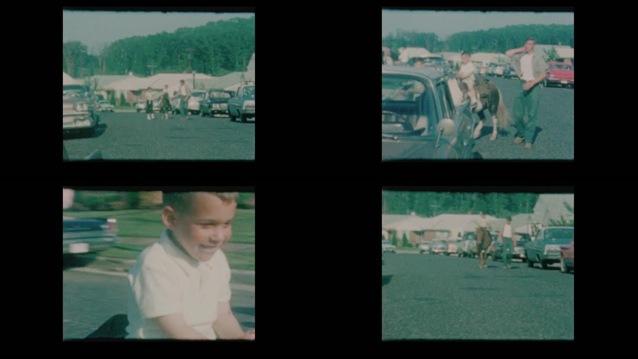 1963小男孩骑小马在郊区街道与古董车