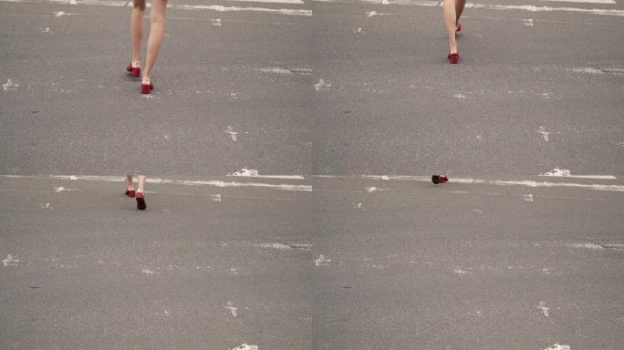一个穿红鞋的女孩过马路。女人的步态。