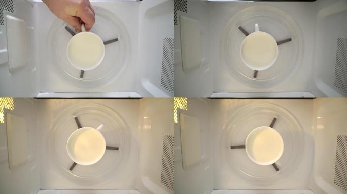 用微波炉加热牛奶。将一杯牛奶放入微波炉中。
