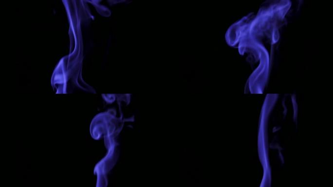 蓝色蒸汽从上升。黑色背景上的蓝色烟雾。黑色背景下的烟雾慢慢漂浮在太空中。慢动作。
