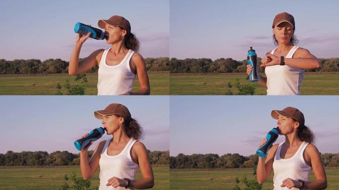 一个运动女人正在喝水。