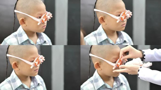 视力检查。有视力障碍的亚洲男孩。从脑部手术中看不到左眼。医疗和康复.视频4k