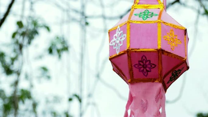 泰国北部风格的兰纳灯笼在风中悬挂和吹动。4k镜头