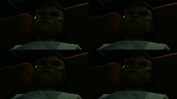 亚洲男孩在电影院欣赏3d电影