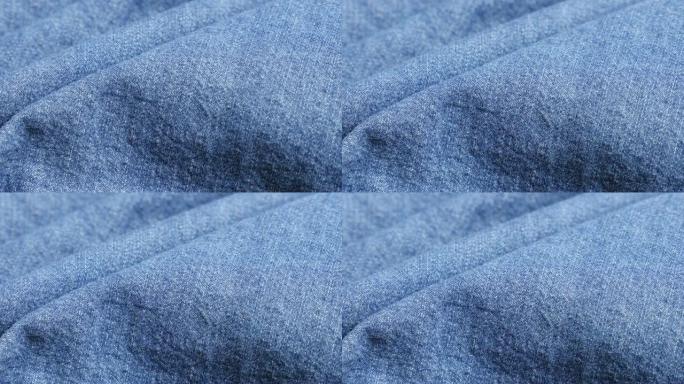 蓝色高品质牛仔布细节和纹理特写倾斜4K 2160p 30fps超高清视频-蓝色杜加里牛仔裤布聚集慢倾