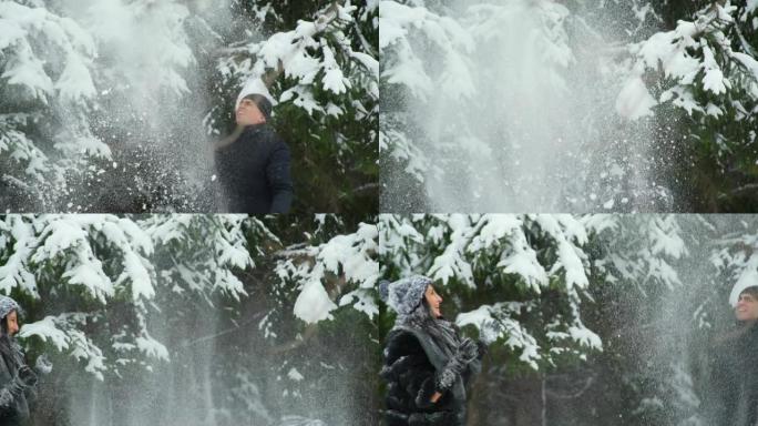 年轻的女人和男人扔雪