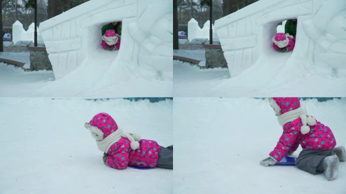 骑小冰滑梯的小女孩