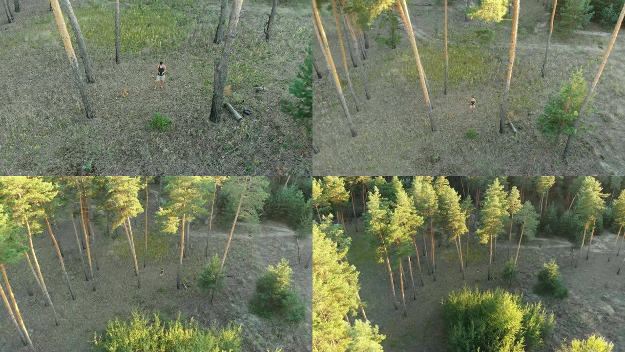 人类在松树林中控制着无人机。四轴飞行器将该人移开并远离他
