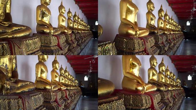 泰国曼谷市Wat Pho的行中的金色佛像