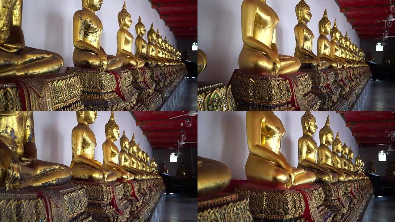 泰国曼谷市Wat Pho的行中的金色佛像