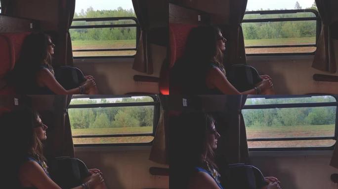 乘坐复古/复古火车旅行的女孩。