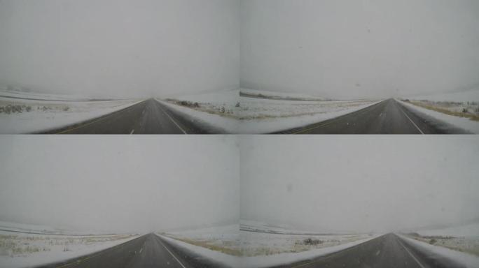 POV驾驶-雪/冰覆盖了ft农村的州际公路。怀俄明州布里奇