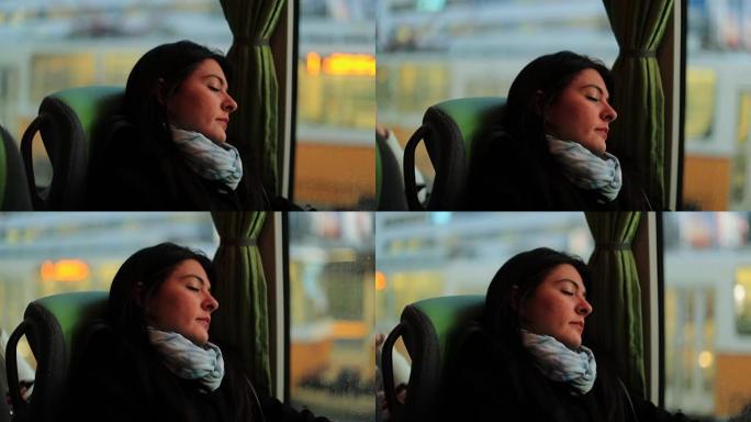 旅行者在公共汽车上睡着了。年轻女子骑马和乘公共汽车旅行时睡觉