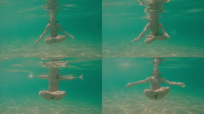 女性水下瑜伽姿势