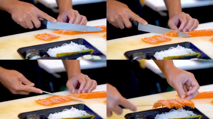 三文鱼切片，放入寿司托盘。