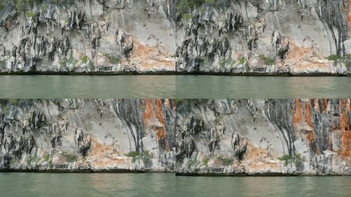 夏季泰国攀牙湾国家公园沿海地区的石灰岩山崖，用于环境，放松，旅行，旅行，季节和气候变化概念