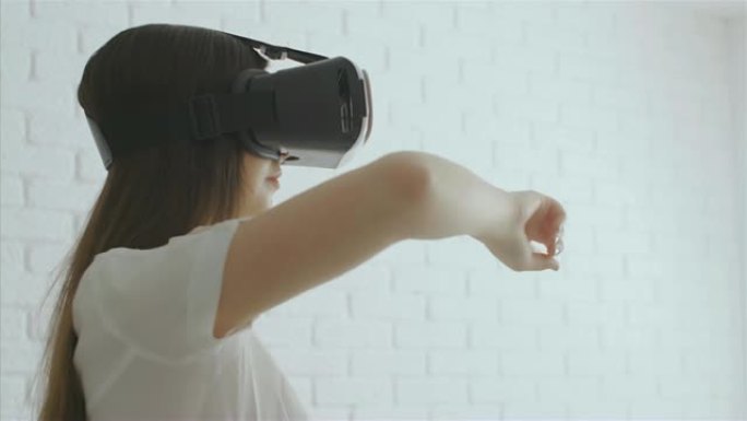 年轻女子用现代虚拟现实眼镜触摸东西，4k