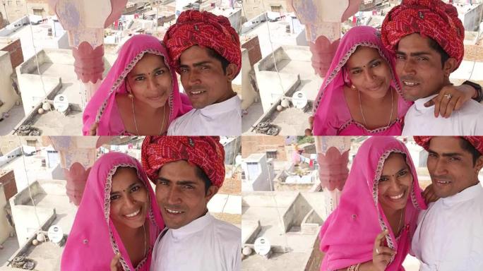 自拍杆相机拍摄印度新娘和新郎在印度的照片和视频