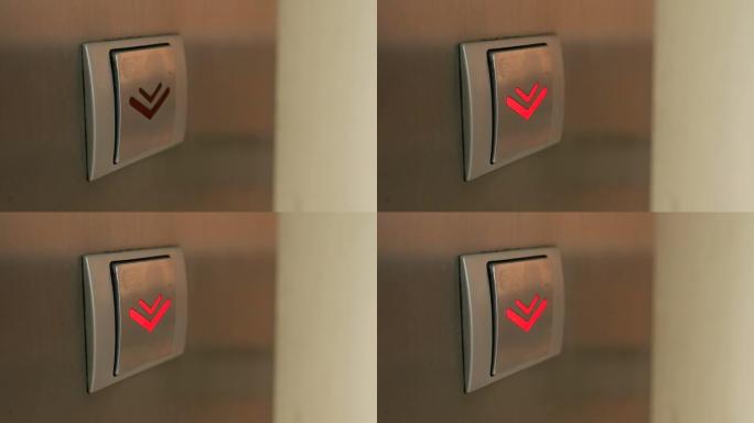 手指向下推动电梯按钮的极端特写