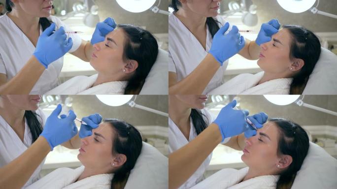 医生或美容师在手套为女性在美容诊所进行脸部抗衰老注射