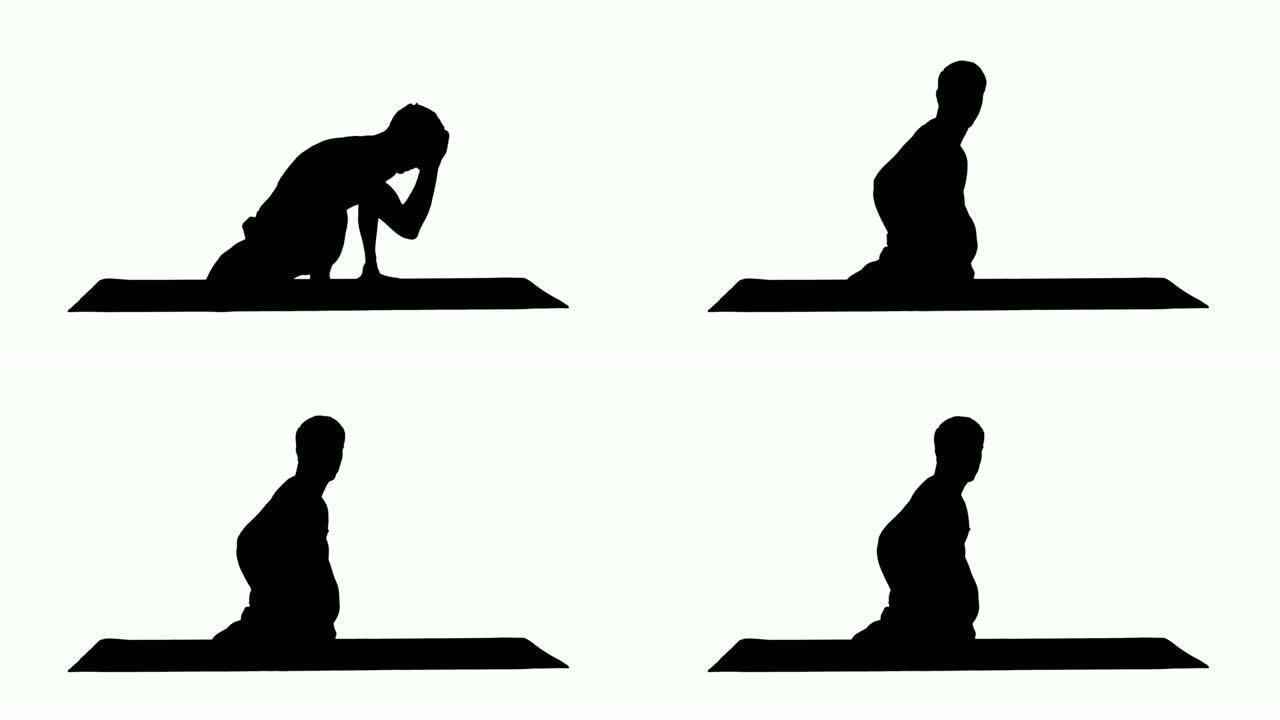 剪影男子练习瑜伽鼠尾草扭转C姿势或Marichyasana姿势伸展运动肌肉与瑜伽冥想放松和恢复健康