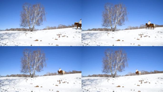 冬天草原雪地上骑马的牧民视频