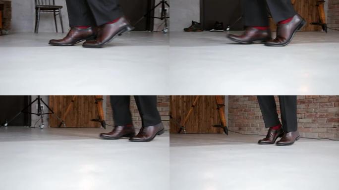 穿着时髦鞋子跳舞的男人的特写镜头，月球漫步