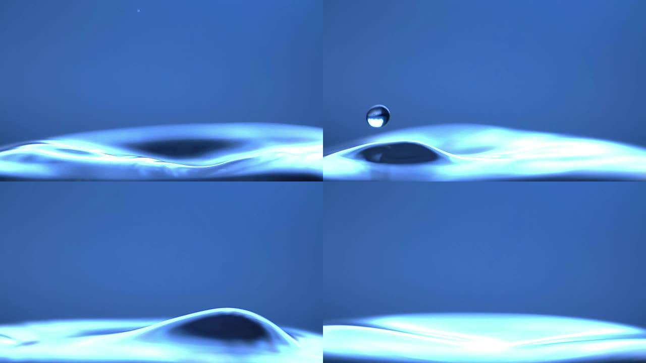 水滴溅入平静的水中-超级慢动作