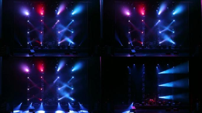 在一场有雾的音乐会上，许多聚光灯照亮了舞台。