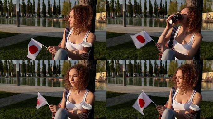 美丽的日本国旗女游客。