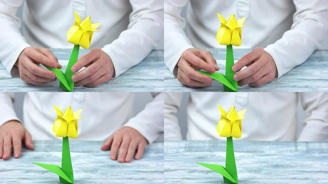 制作黄色折纸花的人。