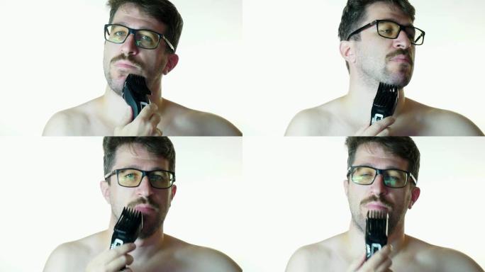 一个男人刮胡子修剪机