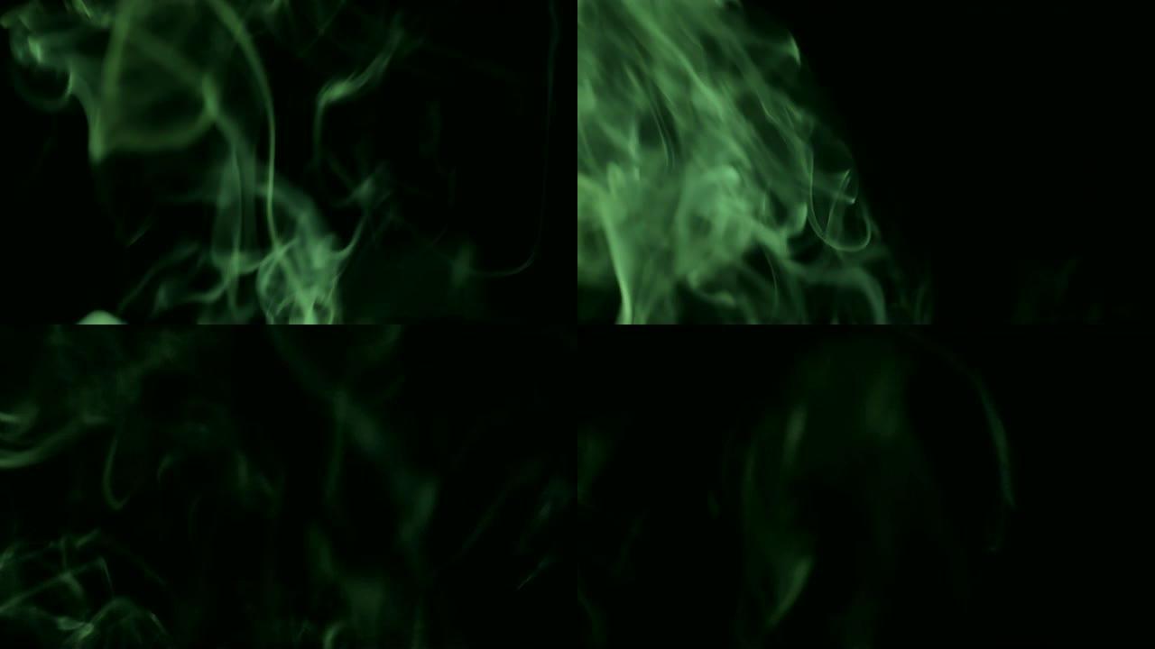 绿色蒸汽从上升。黑色背景上的蓝色烟雾。黑色背景下的烟雾慢慢漂浮在太空中。4K UHD