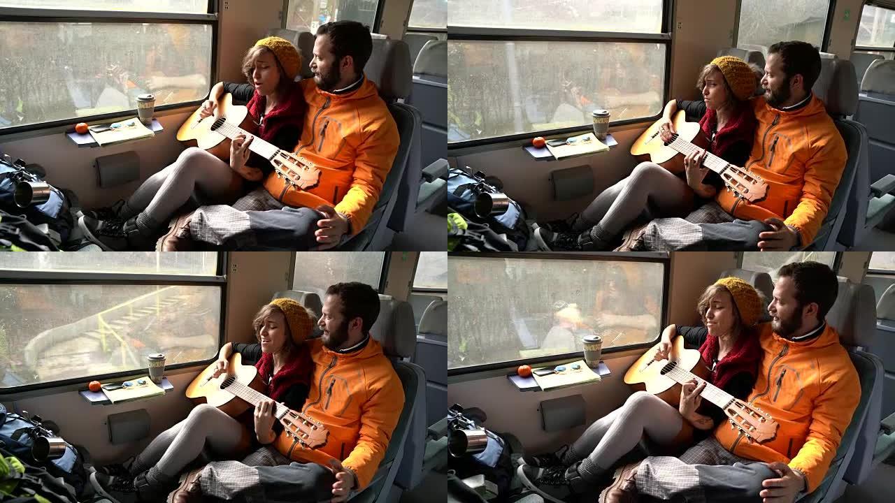 夫妇乘火车旅行并弹吉他