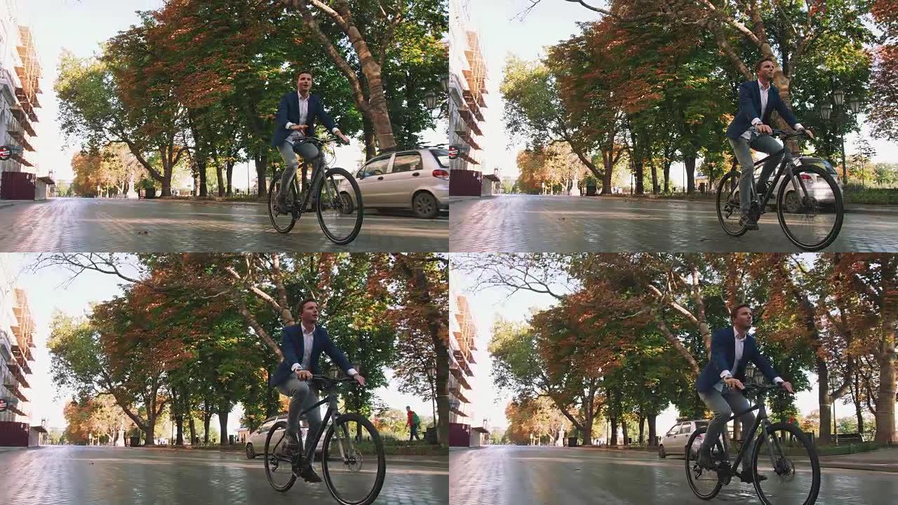 日出时，英俊的年轻人在市中心公园的街道上驾驶自行车，慢动作，跟踪镜头，万向节